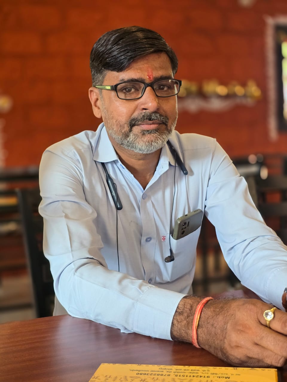 Portrait of Narayandas Chandandas Vaishnav, contractor of full furniture interior work, smiling and confident